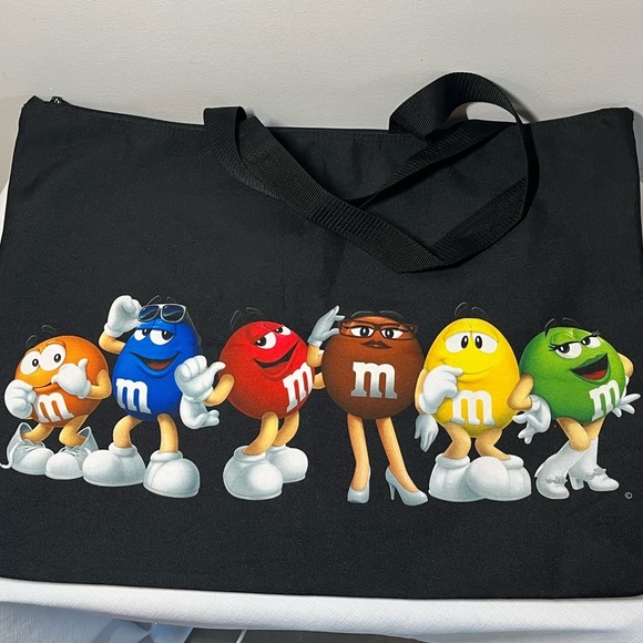 M&M's World graphic tote bag featuring several M&M's characters. - Picture 5 of 9